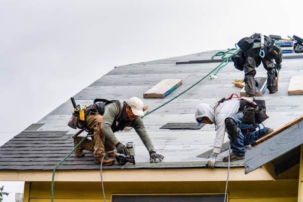 Professional Emergency Roof Repair technician working in Rockaway Park, NY